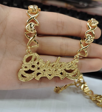 Load image into Gallery viewer, Gold necklace designed XOXO hearts with 'Bridget double plated name plate held in a hand