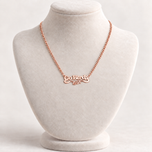 Load image into Gallery viewer, Rose-gold-plated Go Birds eagle pendant necklace on ivory display bust