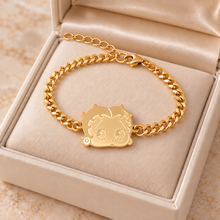 Load image into Gallery viewer, Gold Betty Boop face bracelet in a cream jewelry box showing extender chain