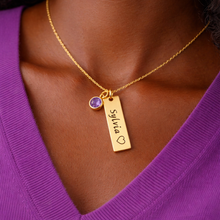 Load image into Gallery viewer, Gold necklace with a pendant worn by a person in a purple shirt