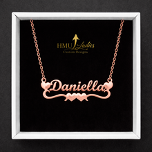 Load image into Gallery viewer, Rose gold double heart bar 'Daniella' necklace on a black display box with HMU Ladies Custom Designs logo.