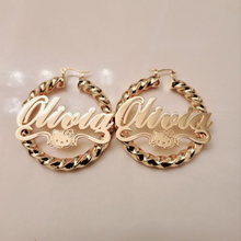 Load image into Gallery viewer, Gold hoop Hello Kitty earrings with 'Olivia' in script text on a beige background.