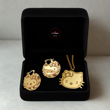 Load image into Gallery viewer, Gold Hello Kitty jewelry set in a black box on a light gray background