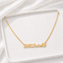 Load image into Gallery viewer, Gold necklace with 'HMU Ladies' with Betty Boop face pendant on a white fabric background