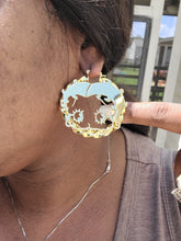 Load image into Gallery viewer, Close-up of a person wearing a gold Betty Boop earring.