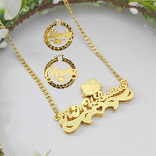 Load image into Gallery viewer, Gold necklace and earrings with 'Hello Kitty' design on a light background