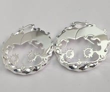 Load image into Gallery viewer, Pair of Betty Boop silver hoop earrings with intricate designs on a light gray background