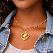 Load image into Gallery viewer, Woman wearing a gold heart-shaped twisted heart pendant with a Barbie Silhouette necklace with a women wearing a denim jacket
