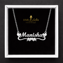 Load image into Gallery viewer, Silver name necklace with double hearts design with 'Manisha' on a black background with HMU Ladies logo