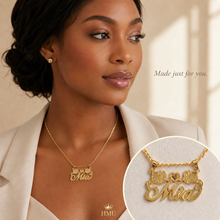 Load image into Gallery viewer, Woman wearing a gold Hello Kitty necklace with 'Mia' pendant, inset showing the necklace on a white background.