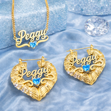 Load image into Gallery viewer, Gold heart jewelry birthstone necklace with earrings with 'Peggy' on a blue textured background