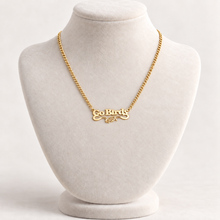 Load image into Gallery viewer, Gold-plated Go Birds eagle pendant necklace on ivory display bust
