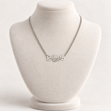 Load image into Gallery viewer, Silver-plated Go Birds eagle pendant necklace on ivory display bust
