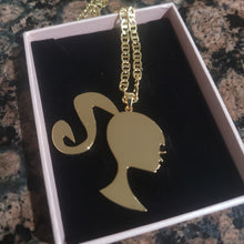 Load image into Gallery viewer, Barbie Silhouette pendant necklace in a pink jewelry box.
