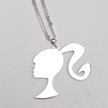 Load image into Gallery viewer, Silver Barbie Silhouette pendant on a chain against a light gray background
