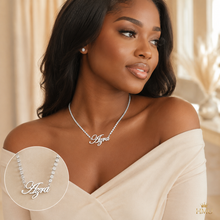 Load image into Gallery viewer, Woman wearing a silver tennis necklace with 'Alora' engraving, set against a neutral background.
