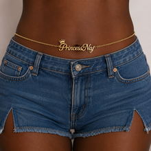 Load image into Gallery viewer, Person wearing blue denim shorts with a gold belt featuring 'Princess Naj' on a neutral background
