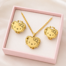 Load image into Gallery viewer, Gold Hello Kitty jewelry set in a pink box on a light pink background
