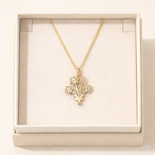 Load image into Gallery viewer, Gold necklace with floral bouquet pendant in a box
