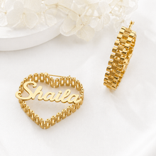 Load image into Gallery viewer, Gold heart-shaped nameplate with 'Shaila' and matching watch style design on a white background
