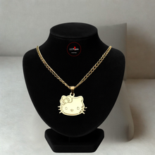 Load image into Gallery viewer, Gold necklace with a Hello Kitty pendant on a black mannequin bust against a neutral background.
