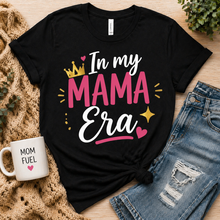 Load image into Gallery viewer, Black t-shirt with 'In my MAMA Era' text, mug, and jeans on a wooden surface
