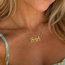 Load image into Gallery viewer, A women wearing a Hello Kitty necklace with the name "Sarah".

