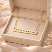 Load image into Gallery viewer, Gold necklace with engraved names in a beige box
