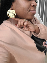 Load image into Gallery viewer, Person wearing a pink sweatshirt with a graphic design, gold Betty Boop earrings, and a ring.
