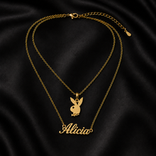 Load image into Gallery viewer, Luxury 18K gold plated layered bunny pendant necklace with custom Alicia nameplate displayed on black silk background
