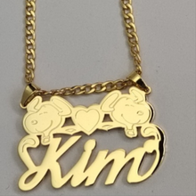 Load image into Gallery viewer, Gold necklace with 'Kim' and two heads Snoopy characters on a gray background
