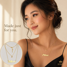 Load image into Gallery viewer, Women in a black dress wearing a double layered birthstone and name necklace with the name 'Mae' with a light cream background.
