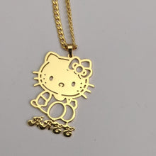 Load image into Gallery viewer, Gold Hello Kitty pendant on a chain against a gray background
