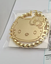 Load image into Gallery viewer, Gold Hello Kitty earrings on a white card with a gray background
