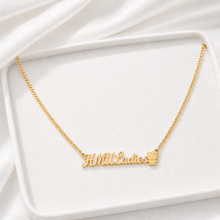 Load image into Gallery viewer, Gold necklace with 'HMULadies' inscription and Hello Kitty on a white fabric background

