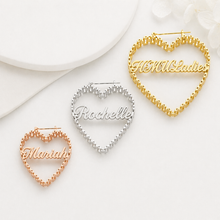 Load image into Gallery viewer, Heart-shaped name pendants in gold, silver, and rose gold on a white background
