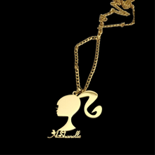 Load image into Gallery viewer, Gold necklace with a Barbie silhouette pendant with name 'A Shanelle' on a black background

