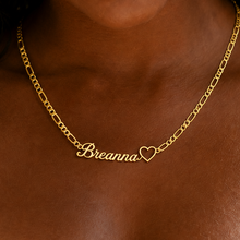 Load image into Gallery viewer, Gold figaro chain necklace with 'Breanna' and a heart charm on a person
